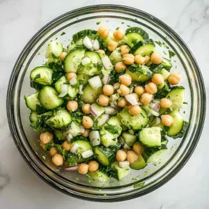 Chickpea and cucumber salad served in a bowl with fresh ingredients