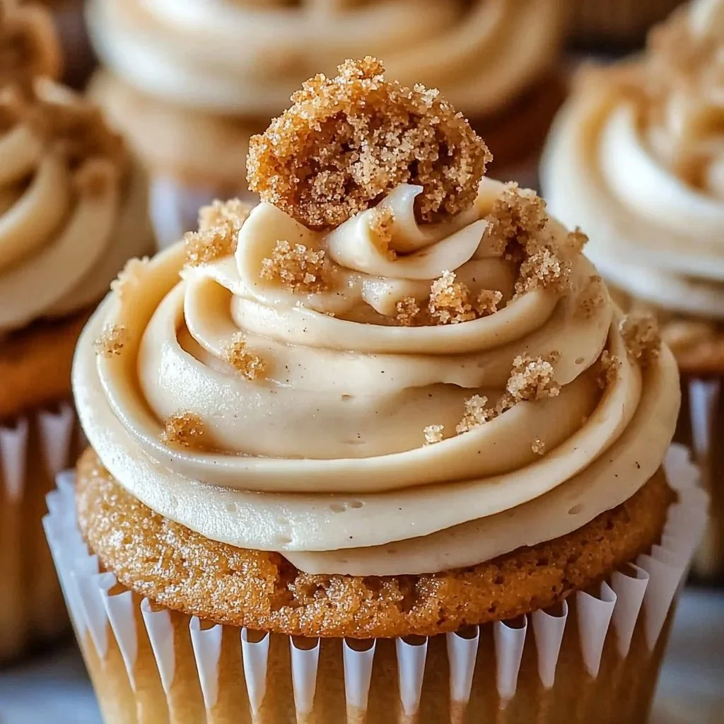 Decadent Biscoff cupcakes topped with creamy frosting and cookie crumbles